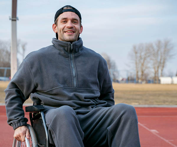 Man with disability in wheelchair Wheelchair user participating in a community program